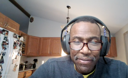 Woman driving a van through nature, enjoying a summer road trip journey.
